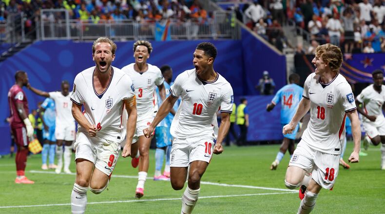 England's Harry Kane (9) celebrates after scoring his side's first goal next to his teammate Jude Bellingham (10) and Anthony Gordon (18) during the World Cup round of 32 soccer match between England and Congo in Atlanta, Wednesday, July 1, 2026. (AP Photo/Butch Dill)