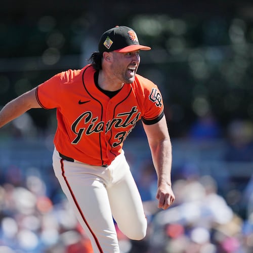 San Francisco Giants starting pitcher Robbie Ray follows through with his pitch delivery during the first inning of a spring training baseball game against the Los Angeles Dodgers Friday, Feb. 27, 2026, in Scottsdale, Ariz. (AP Photo/Ross D. Franklin)