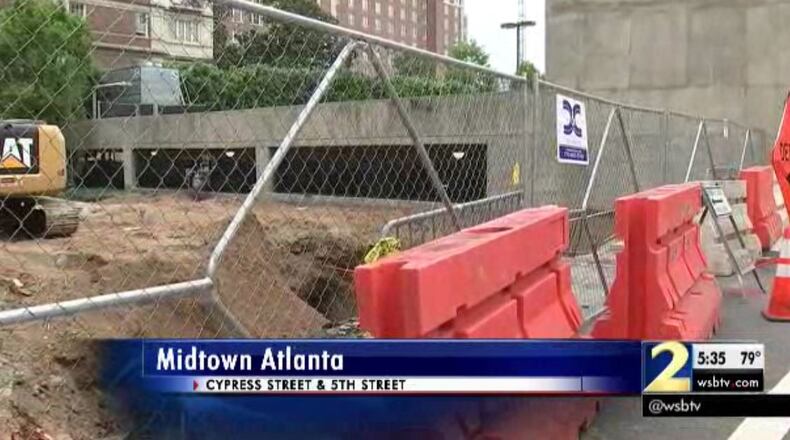 Crews are working to repair a sinkhole on 5th Street in Midtown. (Credit: Channel 2 Action News)