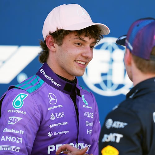 Mercedes driver Kimi Antonelli of Italy talks with Red Bull driver Max Verstappen of the Netherlands after a qualifying session for the Miami Formula One Grand Prix auto race, Saturday, May 2, 2026, in Miami Gardens, Fla. (AP Photo/Rebecca Blackwell)