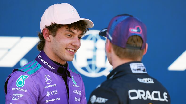 Mercedes driver Kimi Antonelli of Italy talks with Red Bull driver Max Verstappen of the Netherlands after a qualifying session for the Miami Formula One Grand Prix auto race, Saturday, May 2, 2026, in Miami Gardens, Fla. (AP Photo/Rebecca Blackwell)