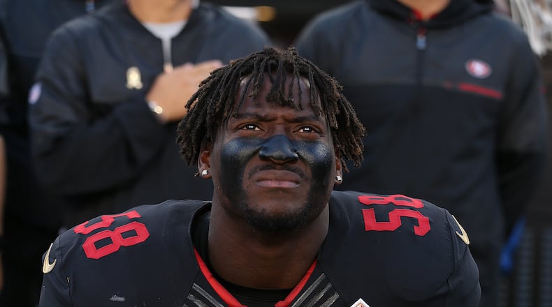San Francisco 49ers linebacker Eli Harold takes a knee during the National Anthem prior to an NFL football game against the Arizona Cardinals earlier this month in Santa Clara, CA. (Daniel Gluskoter/AP Images)