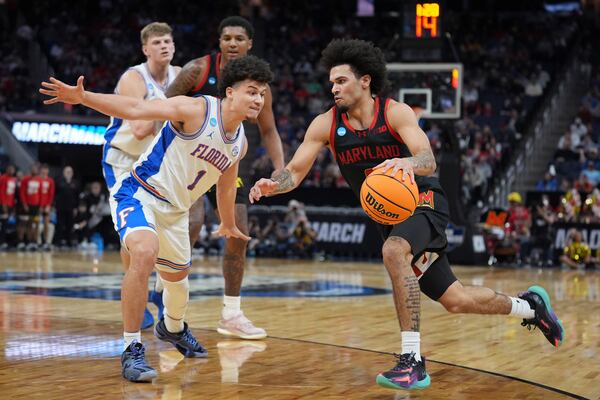 Florida guard Walter Clayton Jr. (1) defends against Maryland guard Ja'Kobi Gillespie during the first half in the Sweet 16 of the NCAA college basketball tournament, Thursday, March 27, 2025, in San Francisco. (AP Photo/Marcio Jose Sanchez)