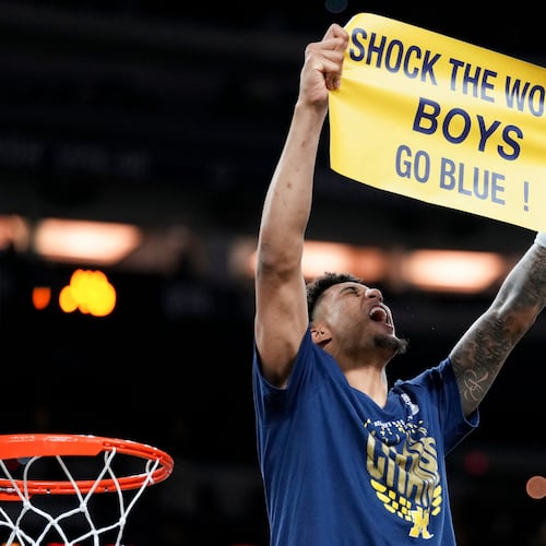 Michigan forward Yaxel Lendeborg celebrates after defeating UConn in the NCAA college basketball tournament national championship game at the Final Four, Monday, April 6, 2026, in Indianapolis. (AP Photo/Abbie Parr)
