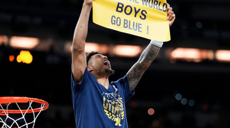 Michigan forward Yaxel Lendeborg celebrates after defeating UConn in the NCAA college basketball tournament national championship game at the Final Four, Monday, April 6, 2026, in Indianapolis. (AP Photo/Abbie Parr)