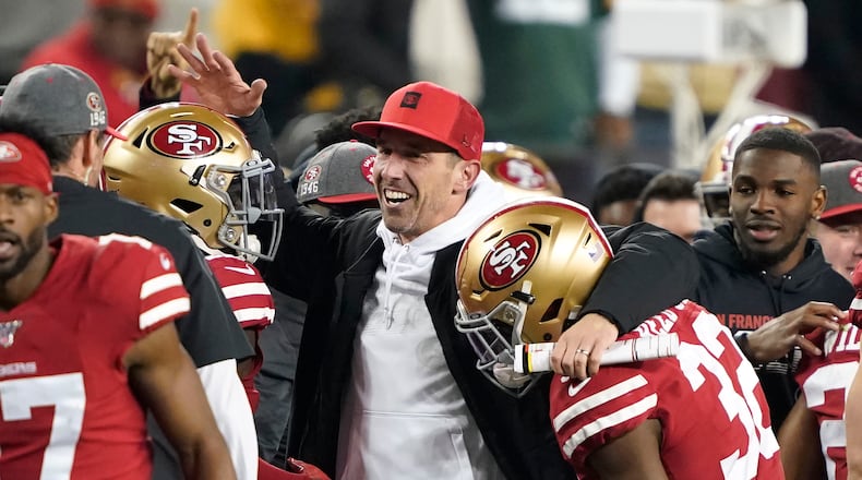 San Francisco 49ers head coach Kyle Shanahan (center) celebrates with players during the NFC Championship game against the Green Bay Packers Sunday, Jan. 19, 2020, in Santa Clara, Calif. The 49ers won 37-20 to advance to Super Bowl 54 against the Kansas City Chiefs.