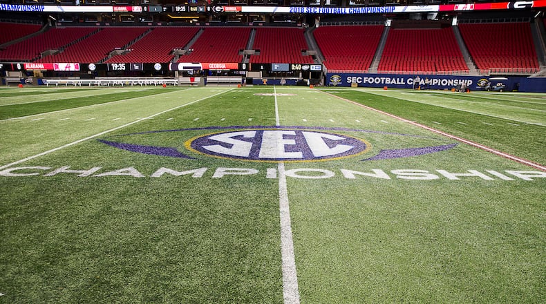 The SEC championship logo is displayed on the field of Mercedes-Benz Stadium before the league's 2018 title game. (AJC file photo by Alyssa Pointer.)