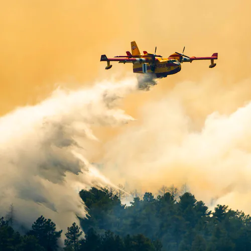 A plane drops a load of water on the Aspen Acres Fire near Colorado City, Colo., on Thursday, July 2, 2026. (Michael Seamans/The Gazette via AP)