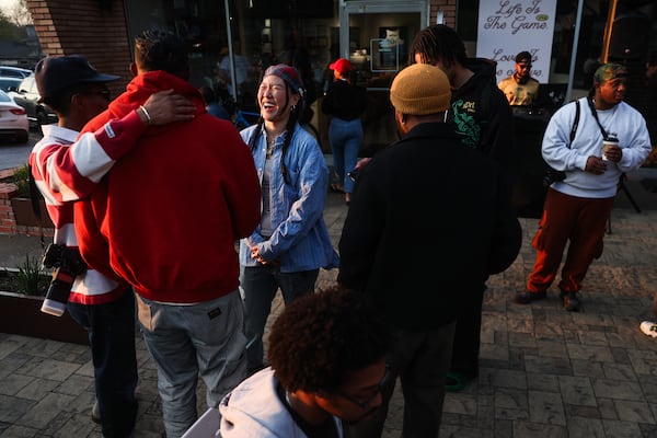 DJ Mikkoh talks with friends before her set at Portrait Coffee in Atlanta on Thursday, March 19, 2026. (Abbey Cutrer/AJC)