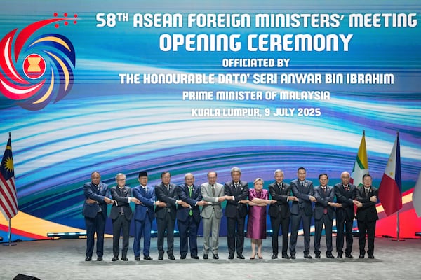 From left to right, East Timor Foreign Minister Bendito dos Santos Freitas, Lao Minister of Affairs Thongsavanh Phomvihane, Indonesia's Foreign Minister Sugiono, Cambodia's Foreign Minister Prak Sokhonn, Brunei's Minister of Foreign Affairs Erywan Yusof, Malaysia's Prime Minister Anwar Ibrahim, Malaysia's Foreign Affairs Minister Mohamad Hasan, Philippine Foreign Secretary Theresa Lazaro, Singapore's Foreign Minister Vivian Balakrishnan, Thailand's Foreign Minister Maris Sangiampongsa, Vietnam's Foreign Minister Bui Thanh Son, Myanmar Ministry of Foreign Affairs representative Kyaw Nyun Oo and ASEAN's Secretary-General Kao Kim Hourn pose for the group photo during the opening ceremony of the Association of Southeast Asian Nations (ASEAN) Foreign Ministers' meeting and related meetings at the Convention Centre in Kuala Lumpur, Malaysia, Wednesday, July 9, 2025. (AP Photo/Vincent Thian)