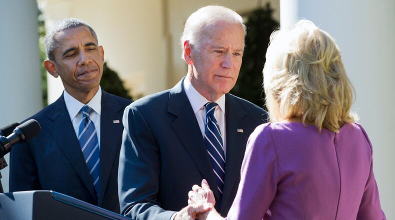 President Barack Obama watches as Vice President Joe Biden turns to his wife Dr. Jill Biden after announcing that he will not run for the presidential nomination, Wednesday, Oct. 21, 2015, in the Rose Garden of the White House in Washington. (AP Photo/Jacquelyn Martin)