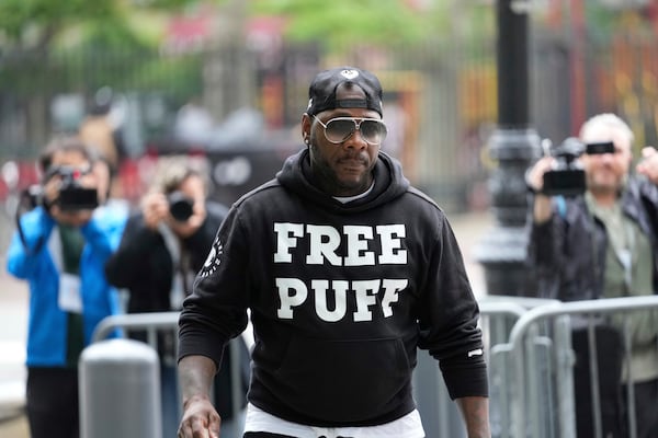 A man arrives to the federal courthouse wearing a shirt supporting Sean "Diddy" Combs in New York, Monday, May 5, 2025. (AP Photo/Seth Wenig)
