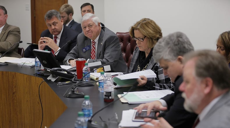 State Senate Appropriations Commission Chairman Jack Hill (center) presented the Senate’s proposed $25 billion budget to the chamber’s Budget Committee. The spending plan calls for 2 percent raises for teachers and most state employees, but child protection workers would see pay increases of 19 percent. BOB ANDRES / BANDRES@AJC.COM