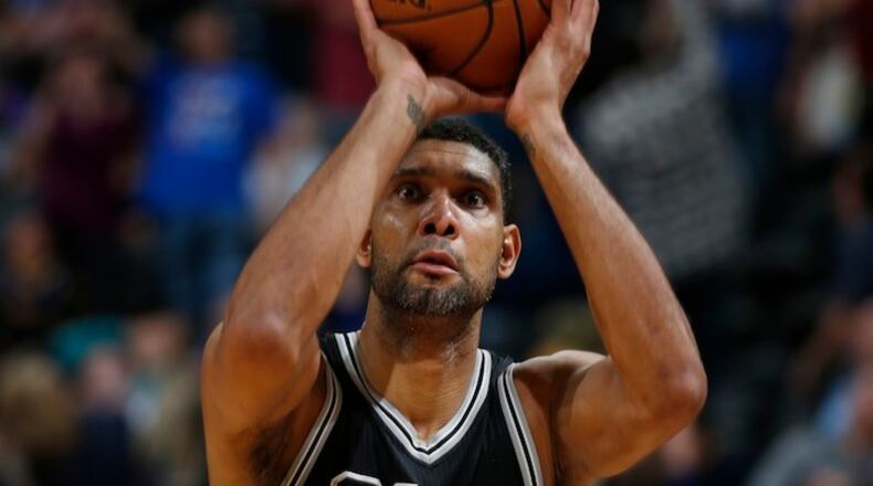 San Antonio Spurs center Tim Duncan (21) in the second half of an NBA basketball game Friday, April 8, 2016, in Denver. The Nuggets won 102-98. (AP Photo/David Zalubowski)