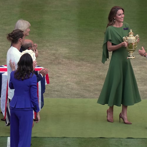 Britain's Princess Kate presents the champion trophy to Jannik Sinner of Italy after winning against Alexander Zverev of Germany in the men's singles final at Wimbledon Tennis Championships in London, Sunday, July 12, 2026. (AP Photo/Brian Inganga)