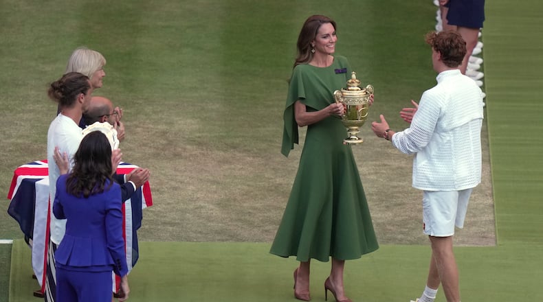 Britain's Princess Kate presents the champion trophy to Jannik Sinner of Italy after winning against Alexander Zverev of Germany in the men's singles final at Wimbledon Tennis Championships in London, Sunday, July 12, 2026. (AP Photo/Brian Inganga)