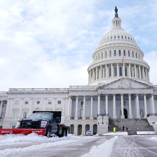 Workers clear the Capitol grounds after a snowstorm Monday, Jan. 26, 2026, in Washington. (AP Photo/Mariam Zuhaib)