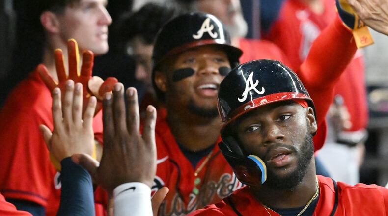 Braves center fielder Michael Harris (foreground) and right fielder Ronald Acuña (background) might have more to celebrate at season's end. (Hyosub Shin / Hyosub.Shin@ajc.com)