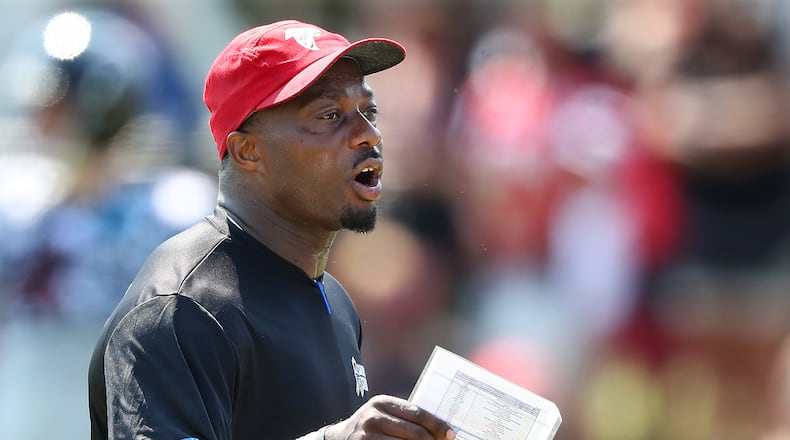 Falcons defensive coordinator Marquand Manuel works with his defense during team practice on Sunday, August 6, 2017, in Flowery Branch. Curtis Compton/ccompton@ajc.com
