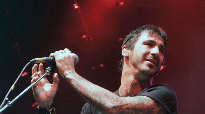 Vocalist Sully Erna of Godsmack performs an acoustic show in 2004, the same year their acoustic EP, “The Other Side,” was released. (AP Photo/ Robert E. Klein)