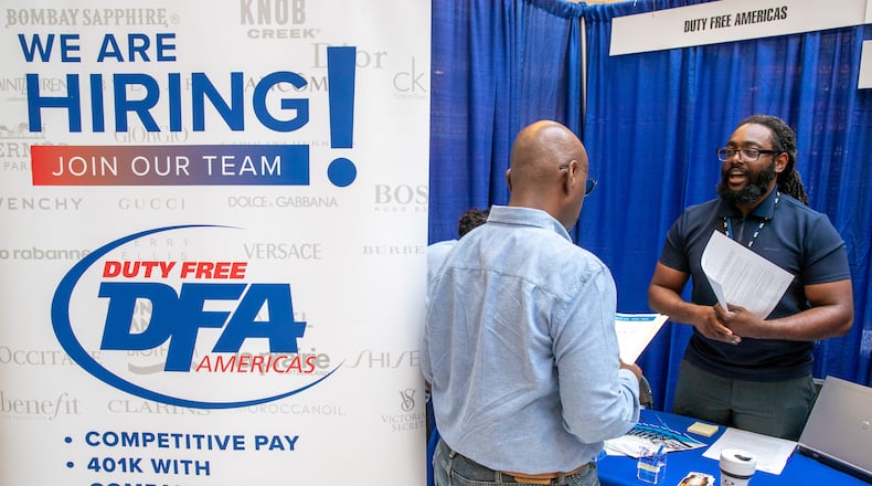 Jelani Walls (R) with Duty Free Americas talks with a potential new employee During the ATL Airport Career Fair at the domestic terminal atrium Monday, June 14, 2020. (Steve Schaefer / steve.schaefer@ajc.com)