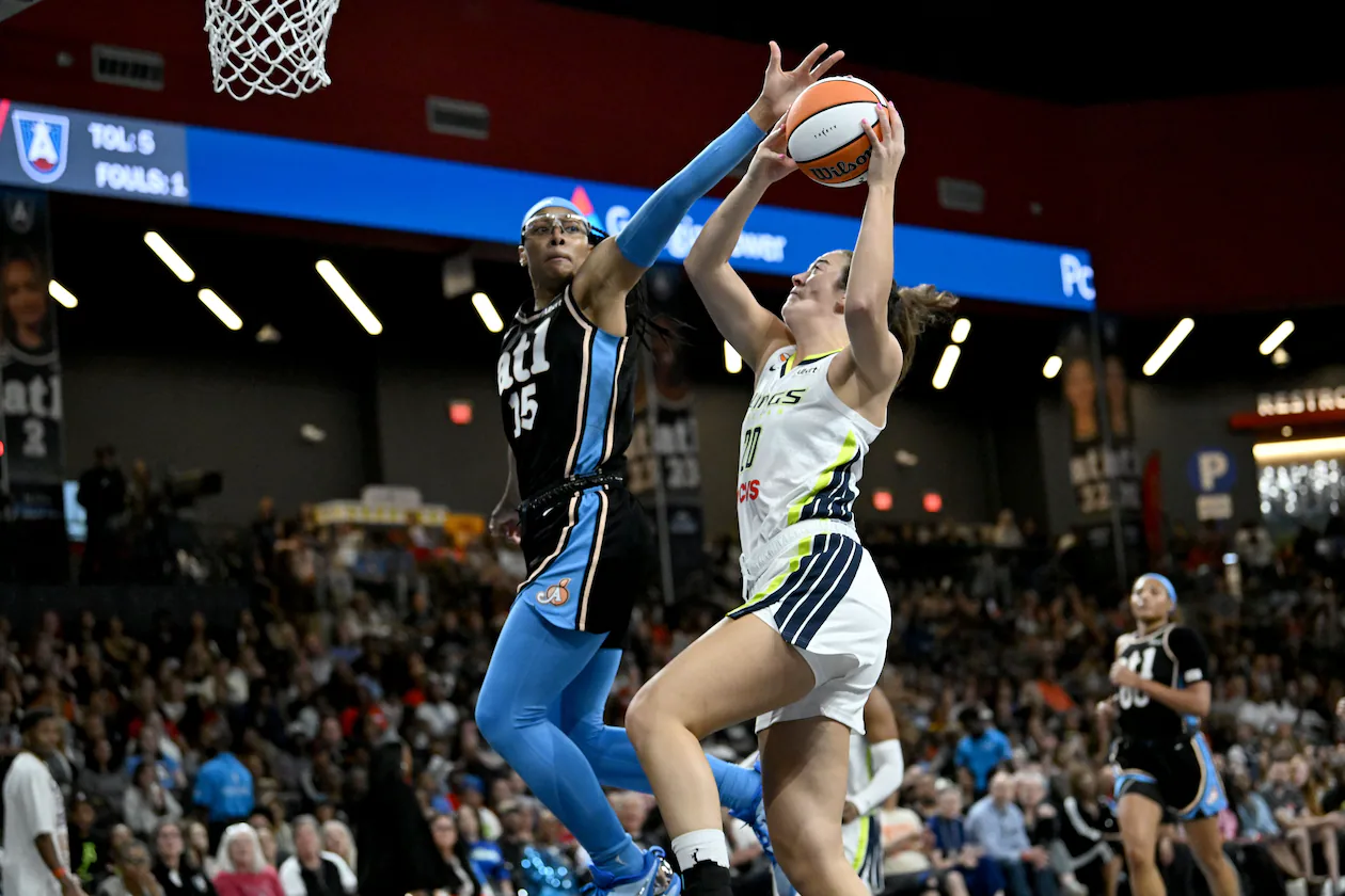 Atlanta Dream guard Allisha Gray (15) blocks a shot by Dallas Wings forward Maddy Siegrist (20) during the first half in a WNBA basketball game at Gateway Center Arena on Friday, May 22, 2026, in Atlanta. (Hyosub Shin/AJC)