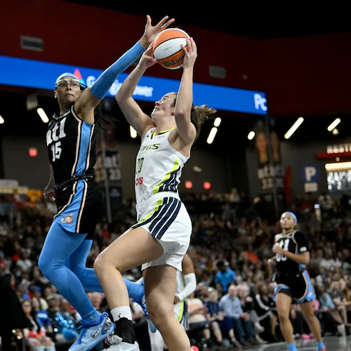 Atlanta Dream guard Allisha Gray (15) blocks a shot by Dallas Wings forward Maddy Siegrist (20) during the first half in a WNBA basketball game at Gateway Center Arena on Friday, May 22, 2026, in Atlanta. (Hyosub Shin/AJC)