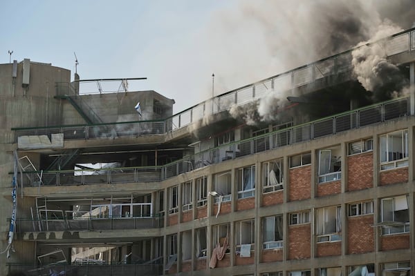Smokes raises from a building of the Soroka hospital complex after it was hit by a missile fired from Iran in Be'er Sheva, Israel, Thursday, June 19, 2025. (AP Photo/Leo Correa)