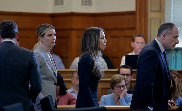 Karen Read heads to the bench for a sidebar with her defense team during her retrial in the Norfolk Superior Court, Monday, May 19, 2025, in Dedham, Mass. (Pat Greenhouse/The Boston Globe via AP, Pool)