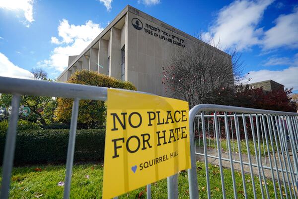 FILE - A sign hangs from a fence outside the dormant landmark Tree of Life synagogue in Pittsburgh's Squirrel Hill neighborhood Oct. 27, 2022, the fourth year since 11 people were killed in America's deadliest antisemitic attack on Oct. 27, 2018, approaches. (AP Photo/Gene J. Puskar, File)