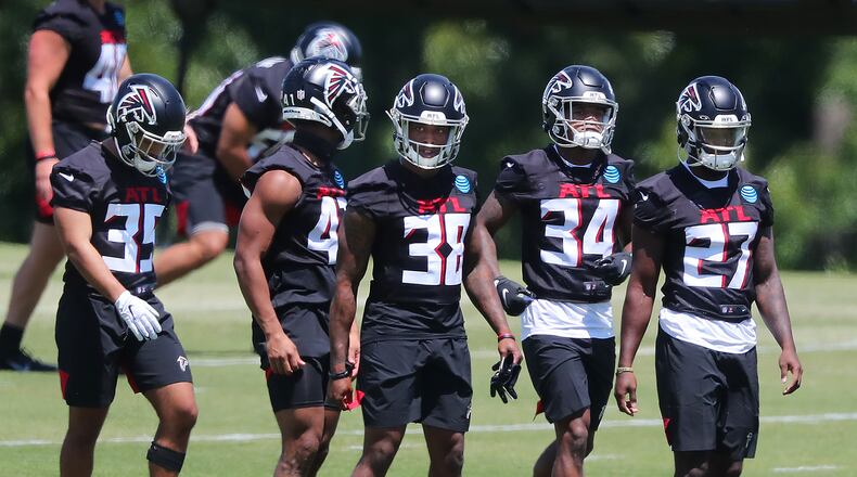051421 Flowery Branch: Atlanta Falcons rookie cornerbacks and safeties Avery Williams (from left), JR Pace, Marcus Murphy, Darren Hall, and Richie Grant line up to run a defensive drill during rookie minicamp on Friday, May 14, 2021, in Flowery Branch.     “Curtis Compton / Curtis.Compton@ajc.com”