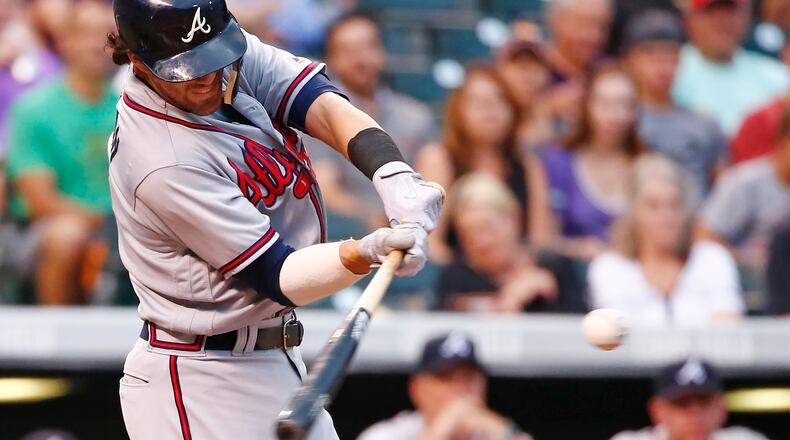 Atlanta Braves’ Dansby Swanson connects for a two run double off Colorado Rockies starting pitcher Kyle Freeland during the second inning of a baseball game Tuesday, Aug. 15, 2017, in Denver. (AP Photo/Jack Dempsey)