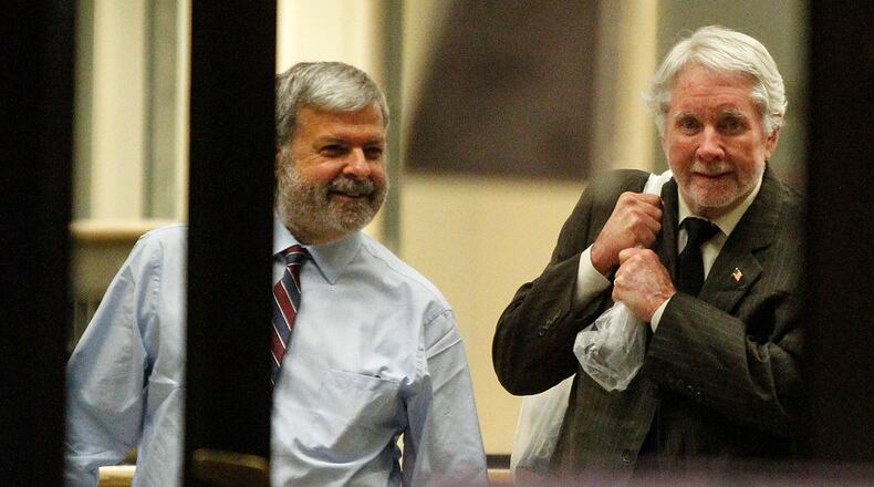12-11-17 - Atlanta, GA - Tex McIver, 74, (right) and his attorney, Don Samuel, leave the Fulton County Jail Monday night after McIver was released on bond. He was carrying a plastic bag full of papers and books.(CASEY SYKES, CASEY.SYKES@AJC.COM)