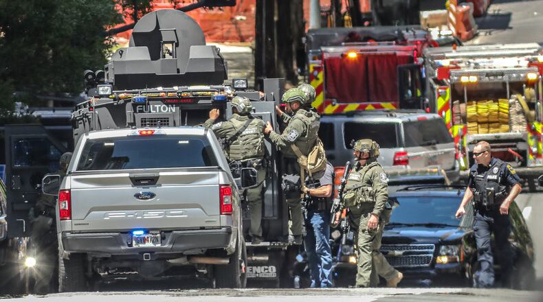 May 5, 2023 Atlanta: West Peachtree Street. Atlanta police and a multi jurisdiction police force swarmed midtown Atlanta on Wednesday, May 3,2023 after 5 people were shot by an active shooter. The suspect tied to the shooting in Midtown that killed one person and injured four was identified by authorities. Deion Patterson, 24, remains at large and police said residents should not approach him, but instead immediately call 911. Those who may know him or know of his whereabouts are also advised to call police. Surveillance photos of the suspect were previously released by officials and depict a man wearing a gray sweatshirt, dark pants and a medical mask carrying what appears to be a black gun. A bag or some other item is strapped to his chest. (John Spink / John.Spink@ajc.com)