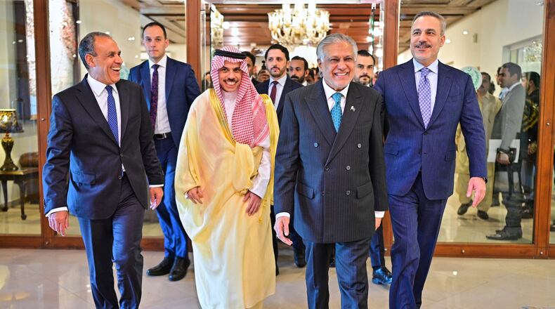 In this photo released by the Pakistan Ministry of Foreign Affairs, from left, Egyptian Foreign Minister Badr Abdelatty, Saudi Arabia's Foreign Minister Prince Faisal bin Farhan Al-Saud, Pakistan's Foreign Minister Ishaq Dar and Turkish Foreign Minister Hakan Fidan walk prior to their meeting to discuss the Middle East war, in Islamabad, Pakistan, Sunday, March 29, 2026. (Pakistan Ministry of Foreign Affairs via AP)