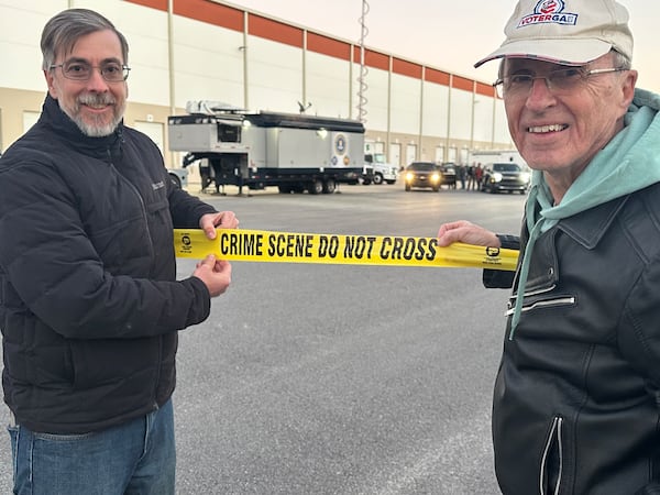 Election integrity activists Jason Frazier and Garland Favorito pose at the scene of the Jan. 28 FBI raid on the Fulton County election hub. (Social media post)