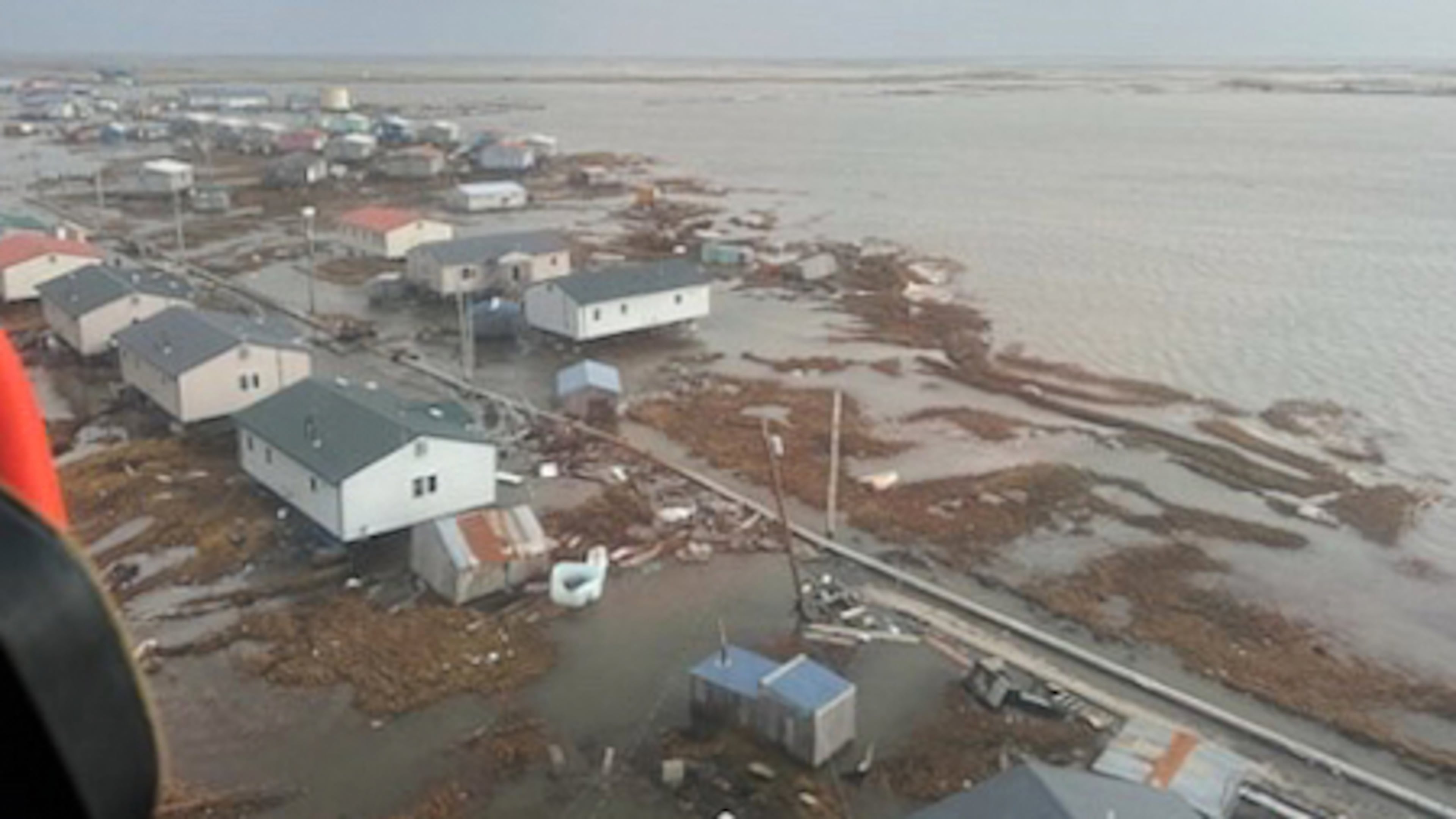 In this photo provided by the U.S. Coast Guard, Kipnuk, Alaska, experiences coastal flooding, Sunday, Oct. 12, 2025. (U.S. Coast Guard via AP)