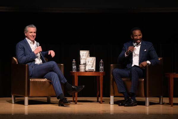 California Gov. Gavin Newsom (left) discussed his new book with Atlanta Mayor Andre Dickens at the Rialto Theater in Atlanta on Sunday. (Riley Bunch/AJC)