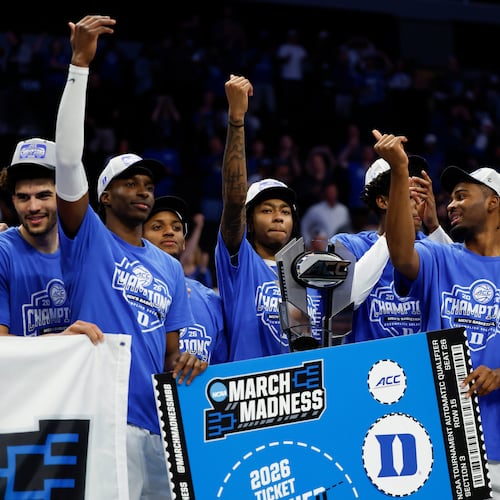 Duke celebrates winning the championship of the Atlantic Coast Conference tournament in an NCAA college basketball game in Charlotte, N.C., Saturday, March 14, 2026. (AP Photo/Nell Redmond)