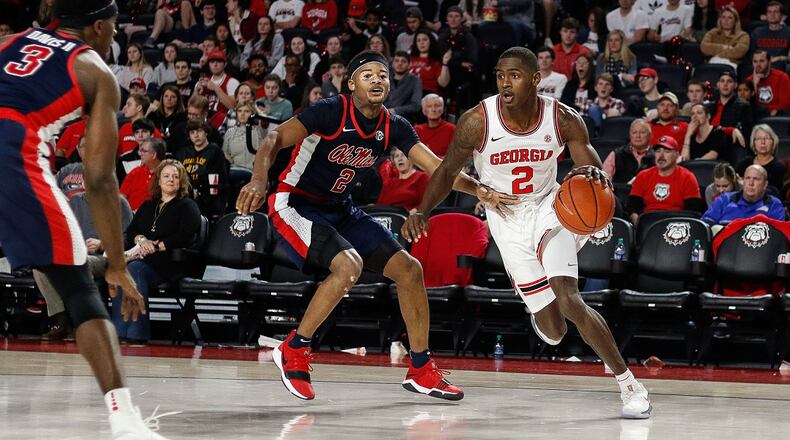Georgia guard Jordan Harris (2) drives past Ole Miss guard Devontae Shuler (2) during game between the University of Georgia and the University of Mississippi at Stegeman Coliseum on Saturday, Feb. 9, 2019. (Photo by Kristin M. Bradshaw)