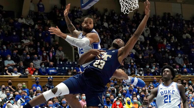 Georgia Tech forward Jordan Meka (23) drives under the basket while Duke forward Theo John defends during the first half Jan. 4 in Durham, North Carolina. (AP Photo/Gerry Broome)