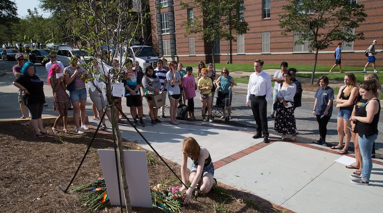 A group of people gather at a memorial for Georgia Tech student Scout Schultz Sunday, Sept. 17, 2017, in Atlanta. Schultz, an engineering student at Georgia Tech, was shot by Georgia Tech campus police after allegedly wielding a what looked like a knife and telling them to shoot, an apparent “suicide by cop.” STEVE SCHAEFER / SPECIAL TO THE AJC