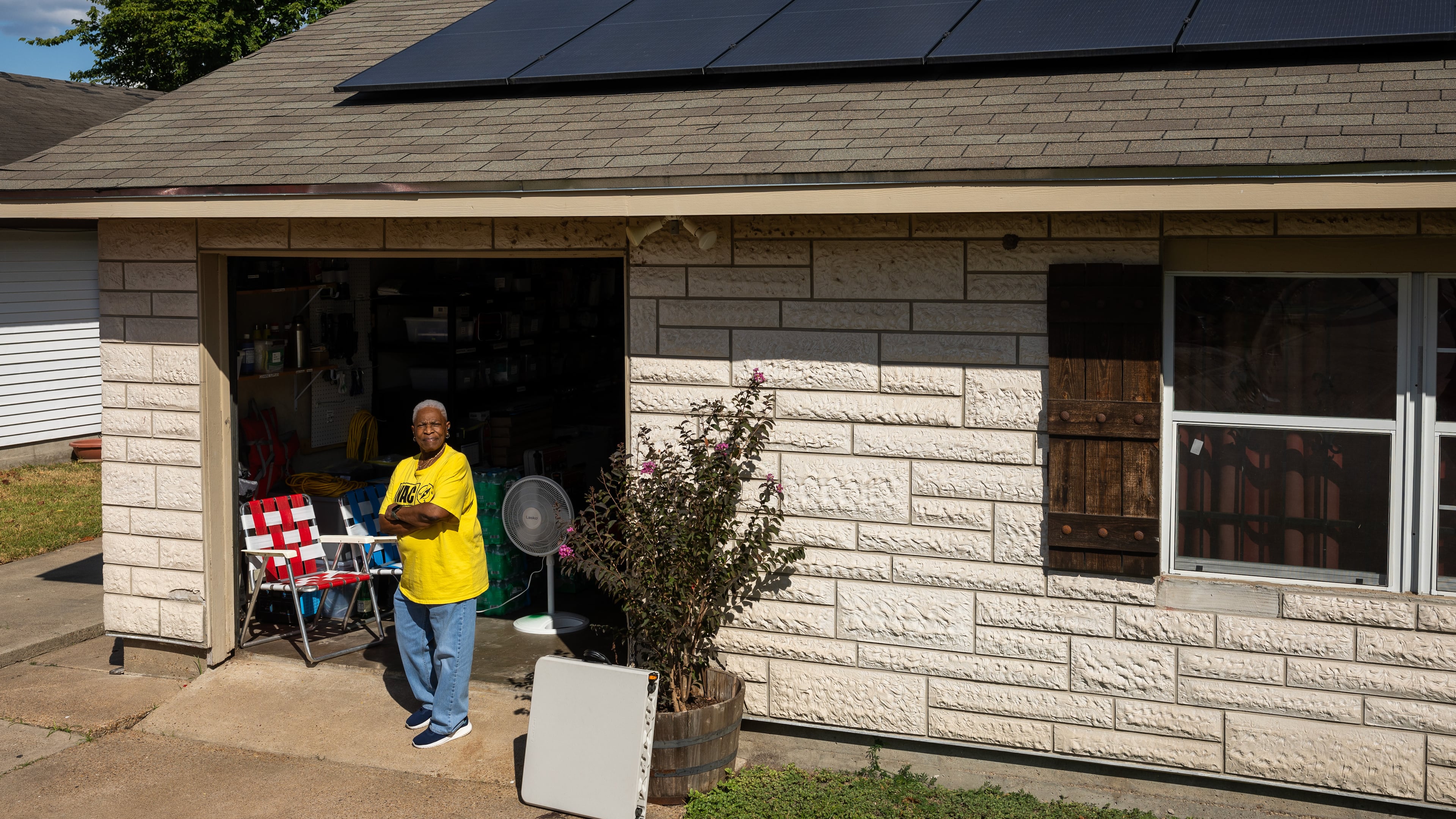 Doris Brown, Hub home captain, poses for a portrait under her solar panels on Wednesday, Oct. 8, 2025, in Houston. (AP Photo/Antranik Tavitian)