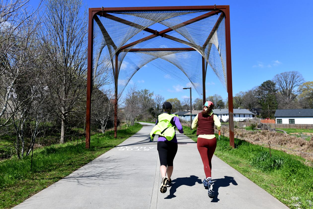 Joggers exercise on Atlanta Beltline Southwest Trail, Thursday, March 12, 2026, in Atlanta. The Atlanta Beltline announced that it has a new designation: home of the world's longest linear arboretum, spanning more than 12 miles of completed trail. (Hyosub Shin/AJC)