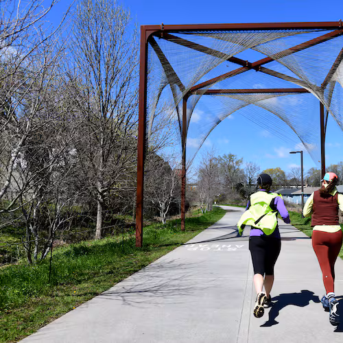 Joggers exercise on Atlanta Beltline Southwest Trail, Thursday, March 12, 2026, in Atlanta. The Atlanta Beltline announced that it has a new designation: home of the world's longest linear arboretum, spanning more than 12 miles of completed trail. (Hyosub Shin/AJC)