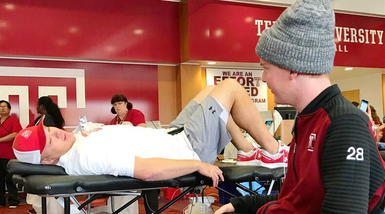 While the coach at Temple last November, Georgia Tech coach Geoff Collins opened the football facility for a blood drive and made a donation himself in honor of Temple assistant equipment manager Kane Ivers-Osthus (in wheelchair) after Ivers-Osthus required dozens of transfusions to treat a rare form of leukemia. (Photo courtesy Kane Ivers-Osthus)
