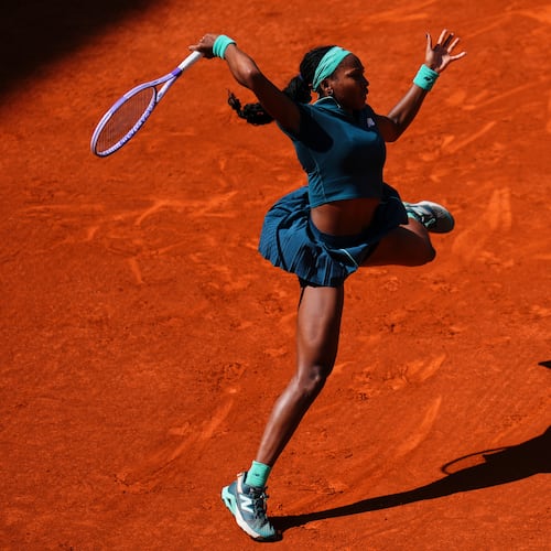 Coco Gauff of the U.S. returns the ball to Sorana Cirstea of Romania during the Madrid Open tennis tournament in Madrid, Sunday, April 26, 2026. (AP Photo/Manu Fernandez)