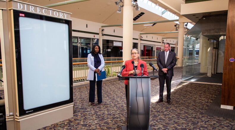 U.S. Rep. Carolyn Bourdeaux talks during a press conference flanked by Gwinnett County Commission Chairwoman Nicole Love Hendrickson (L) and Gwinnett Place Community Improvement District Director Joe Allen (R) at the mostly vacant Gwinnett Place Mall in Duluth. STEVE SCHAEFER FOR THE ATLANTA JOURNAL-CONSTITUTION