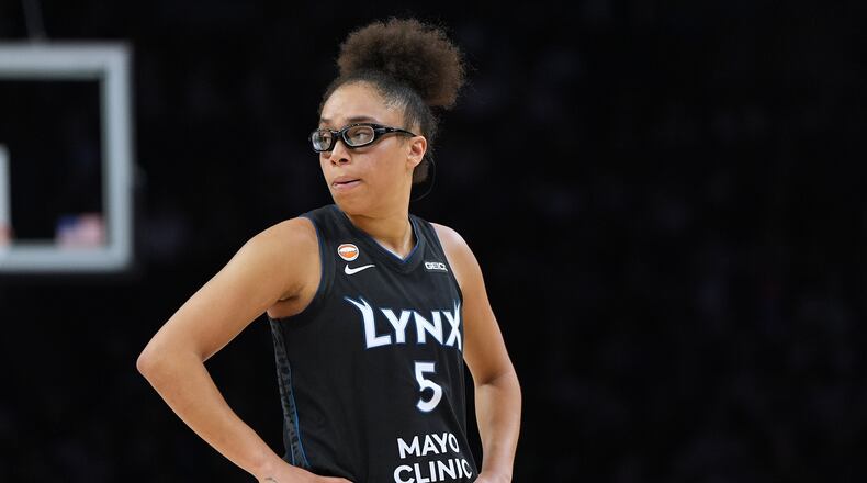 Minnesota Lynx guard Olivia Miles stands on the court during the second half of a WNBA basketball game against the New York Liberty, Friday, Sept. 18, 2026, in Minneapolis. (AP Photo/Abbie Parr)