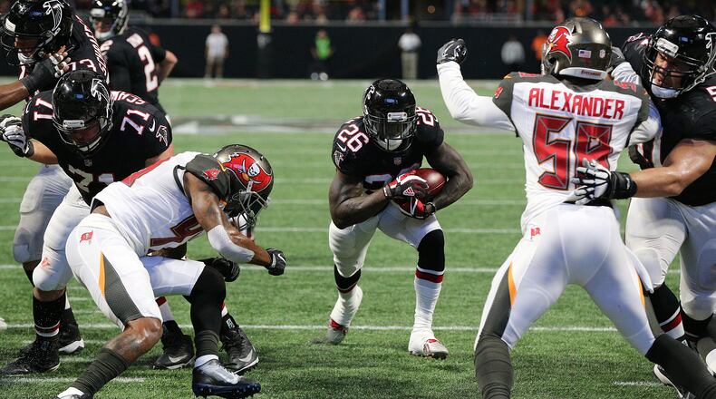 November 26, 2017 Atlanta: Falcons running back Tevin Coleman rushes for his first of two second half touchdowns to take a 27-6 lead over the Buccaneers during the third quarter in a NFL football game on Sunday, November 26, 2017, in Atlanta. Curtis Compton/ccompton@ajc.com